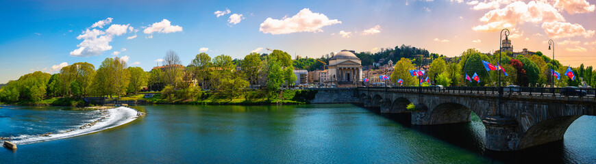 Turin Italy Panoramic view of the Po River, the Gran Madre Church, the Monte dei Cappuccini Church, and the Vittorio Emanuele I Bridge in Torino, the capital city of Piedmont