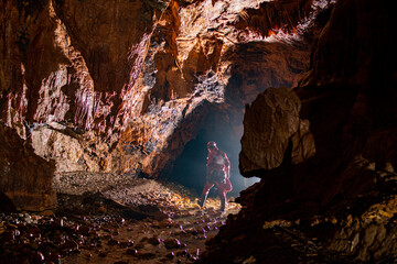 People exploring the cave river