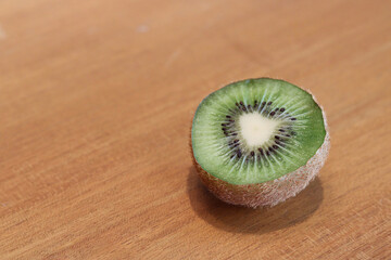 Kiwi fruit on old wooden background