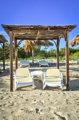 Front view lounge chairs on the beach