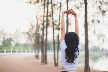 A concept of smiling female happy with life having inspiration, stretching, freedom, deep breath fresh air, positive, wellbeing, dreaming, euphoria, carefree, joy, spirit, celebrate life. Clam happy