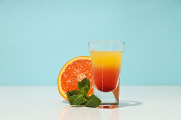 Shot with orange taste, tasty citrus shot concept