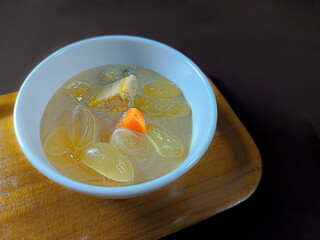 Close-up view of Kolak, a popular Indonesian dessert during Ramadan. Kolak is a dessert that consists of banana, kolang-kaling, sweet potato, served in sweet and warm coconut milk.