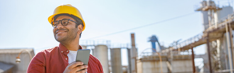 Multiracial construction engineer leading production process outdoors