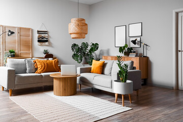 Interior of living room with green houseplants and sofas © Pixel-Shot