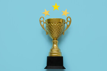 Gold cup with stars on blue background