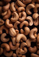 Close up of Roasted cashew nuts background collection. Top view Fresh, Tasty, and healthy food scattered cashew nuts
