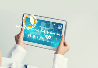 Close of female doctor hands working with tablet pc computer