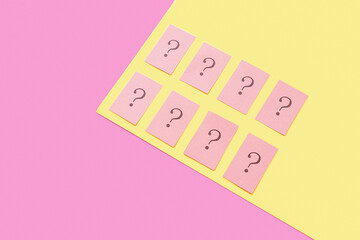 Papers with question marks on color background