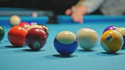 Caucasian Woman Playing Game of Eight Ball Pool	