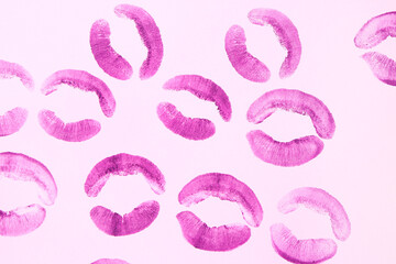 Purple lipstick kiss marks on lilac background