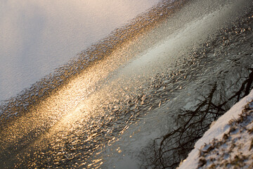 The snow and ice. The background consisting of ice and snow on the frozen river.