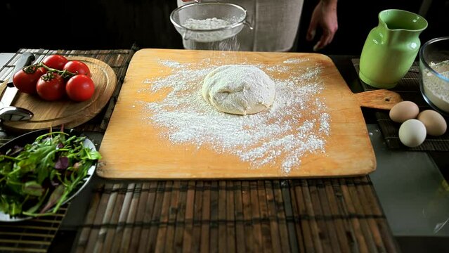 Baker kneading dough making bread pastry
