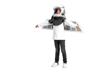 A young boy imagines that he is flying in a pilot's helmet