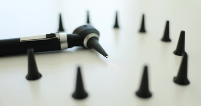 Otoscope for ear diagnostics with interchangeable tips. Otorhinolaryngologist service concept and otitis treatment