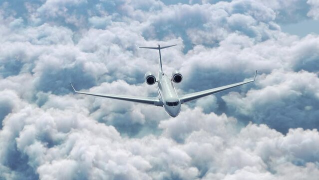 Tracking Shot of Private Business Jet Airplane Flying Above the Clouds in Bright Sunny Day. 