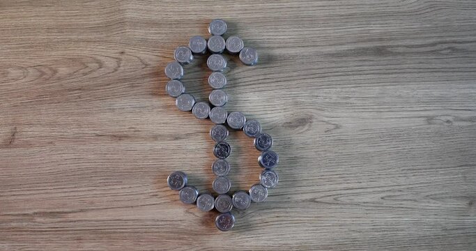 Stacks of coins dollar shaped sign financial investment. Global economic trends and dollar hegemony
