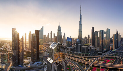 Dramatic sunrise over Dubai skyline panorama with Burj Khalifa and luxury skyscrapers, United Arab Emirates