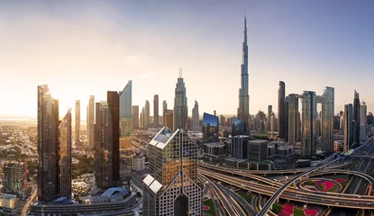 Washable wall murals Burj Khalifa Dramatic sunrise over Dubai skyline panorama with Burj Khalifa and luxury skyscrapers, United Arab Emirates