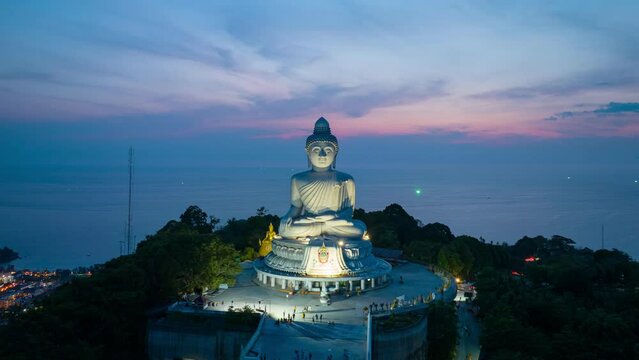 aerial Hyperlapse view Phuket Big Buddha is one of the island most .important and revered landmarks on hill top of Phuket island..beautiful sunset behind Phuket big buddha.beautiful nature background