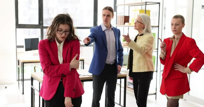 Stressed exhausted business woman intern tired of being disrespected or discriminated against in meeting. Frustrated depressed female student feeling sad and colleagues criticizing at group briefing