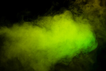 Yellow and green steam on a black background.