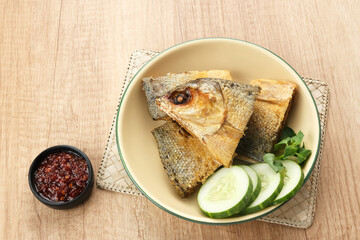 Bandeng Presto or Milkfish with high pressure cooked, served with chilli sauce (sambal), Indonesian food

