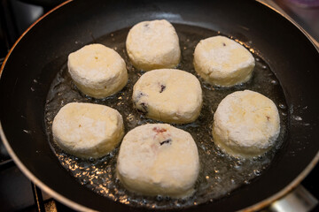 Homemade tasty cheesecakes are fried in pan,  traditional dish Ukrainian