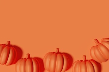 3d render of orange metallic pumpkins border on an orange monochrome background