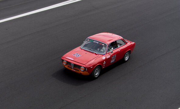 Vintage racing car, classic retro motor sport action, Alfa Romeo Giulia Sprint GTA on asphalt race track