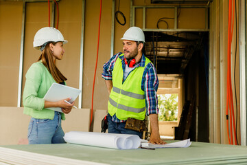 Architect and foreman meeting at construction site,Architect inspects the construction site,Construction project concept.