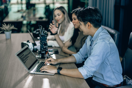 An interning college student sharpened his writing skills in preparing for coding robotic software. Learning in realistic conditions to become a future coder, startup and entrepreneur in stem field - Powered by Adobe