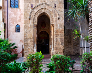 Fototapeta na wymiar Entrance of the Belltower of church Martorana, Palermo. Sicily