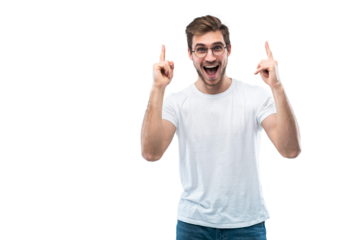 Portrait of a happy young man pointing fingers up at copy space isolated over transparent background
