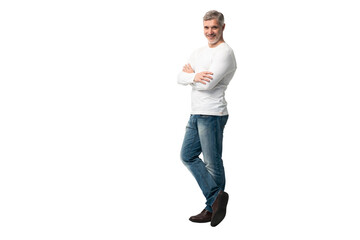 Full body portrait of relaxed mature man standing with arms crossed over transparent background
