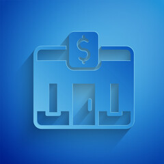 Paper cut Bank building icon isolated on blue background. Paper art style. Vector