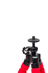 Mini tripod with flexible red legs and mobile phone holder.