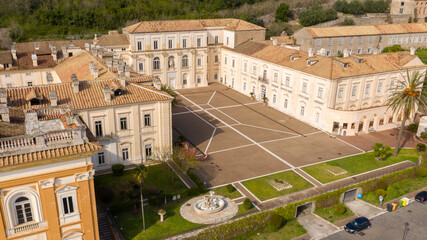 Aerial view of the Belvedere di San Leucio, a monumental complex located in Caserta, in Campania, Italy. It is Unesco world heritage site and an ancient Bourbons Royal residence and silk factory. - obrazy, fototapety, plakaty