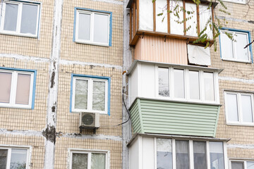 fragment of a facade of a building with balcony.