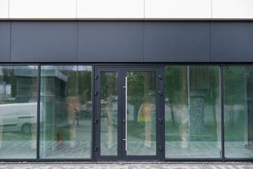 Outside solid glass door with building exterior