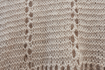 Knitted wool texture. Knitted pattern, air loops.