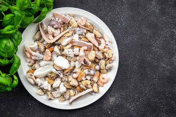 seafood frozen food Seafood Cocktail mussels, rapan, octopus, scallop, squid healthy meal food snack on the table copy space food background rustic top view pescatarian diet