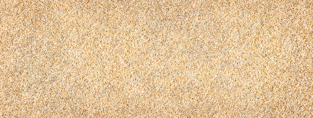 Fototapeta na wymiar Sand. Texture, surface of sea sand. Natural background. Close-up. View from above. Smooth. Copy space 