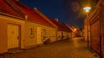 the illuminated cobblestone street Strandstræde in Kalundborg