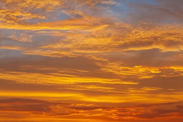 Nature's Canvas: A Stunning Sunset Sky of Orange, Red, and Blue, Illuminating the Evening Cloudscape