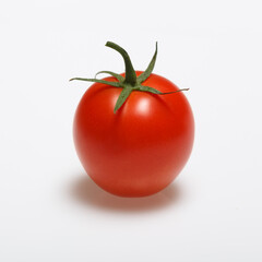 Red tomato on white background