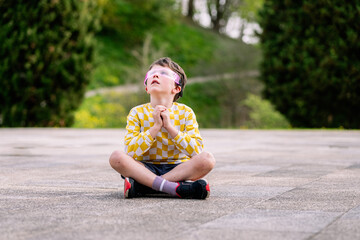 child plays with futuristic glasses outside