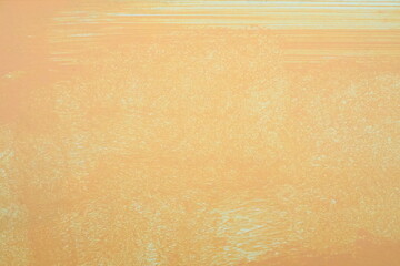 Orange oil painting on plastered wall. Oil paint texture with brush and palette knife strokes. Modern art concept. Horizontal fragment.