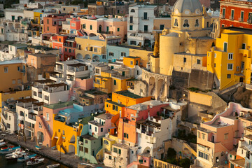 Beautiful fishing villagein magic sunset, Marina Corricella on Procida Island, Bay of Naples, Italy.