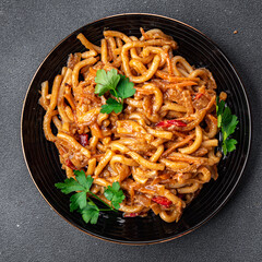 asian noodles vegetable tomato sauce meal food snack on the table copy space food background rustic top view 
